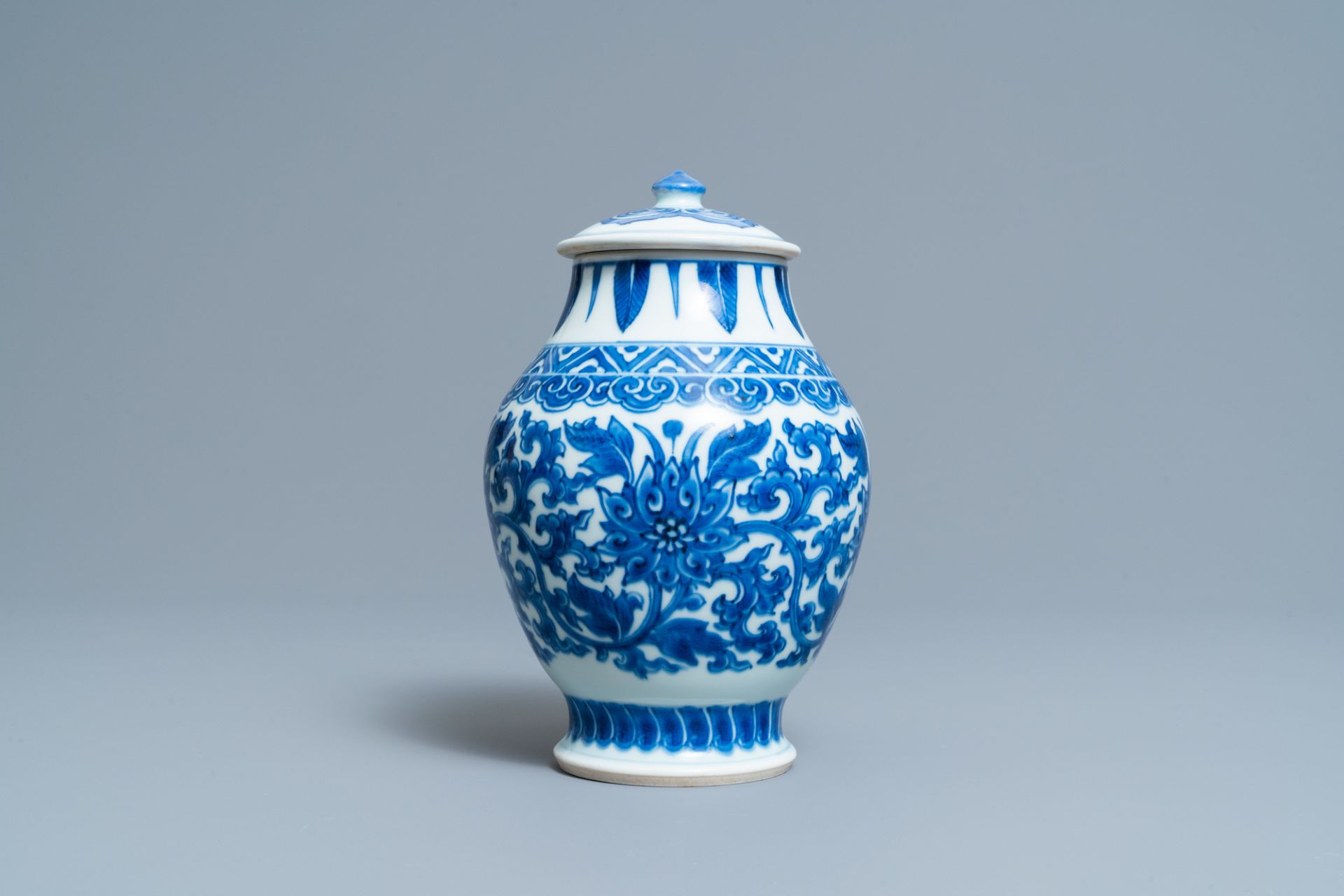 A Chinese blue and white 'lotus scroll' jar and cover, Transitional period - Image 3 of 6