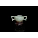 A Chinese celadon jade two-handled libation cup, Ming