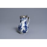 A silver-mounted Dutch Delft blue and white chinoiserie jug, 17th C.