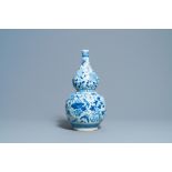 A Chinese blue and white double gourd vase, 19th C.