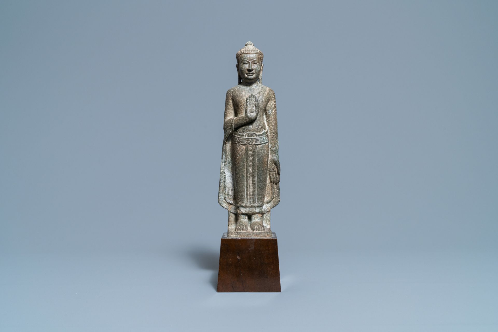 A Thai sandstone figure of Buddha, Khmer, Lopburi, 12/14th C.