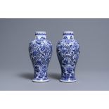 A pair of Chinese blue and white vases with floral design, Kangxi