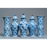 A large Chinese blue and white five-piece garniture with floral and landscape panels, Kangxi