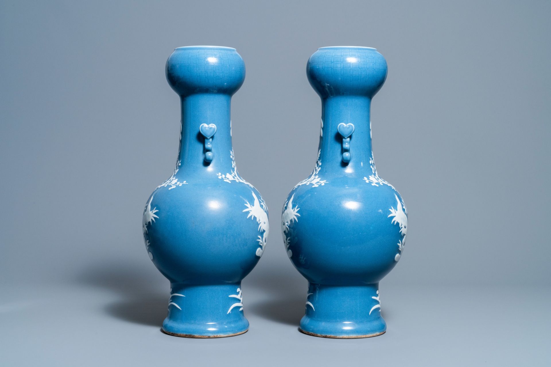 A pair of Chinese white slip-decorated blue-ground vases, 19th C. - Image 2 of 6