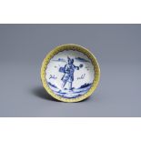 A polychrome Dutch Delft deep saucer dish inscribed 'Jakop rebel', 18th C.