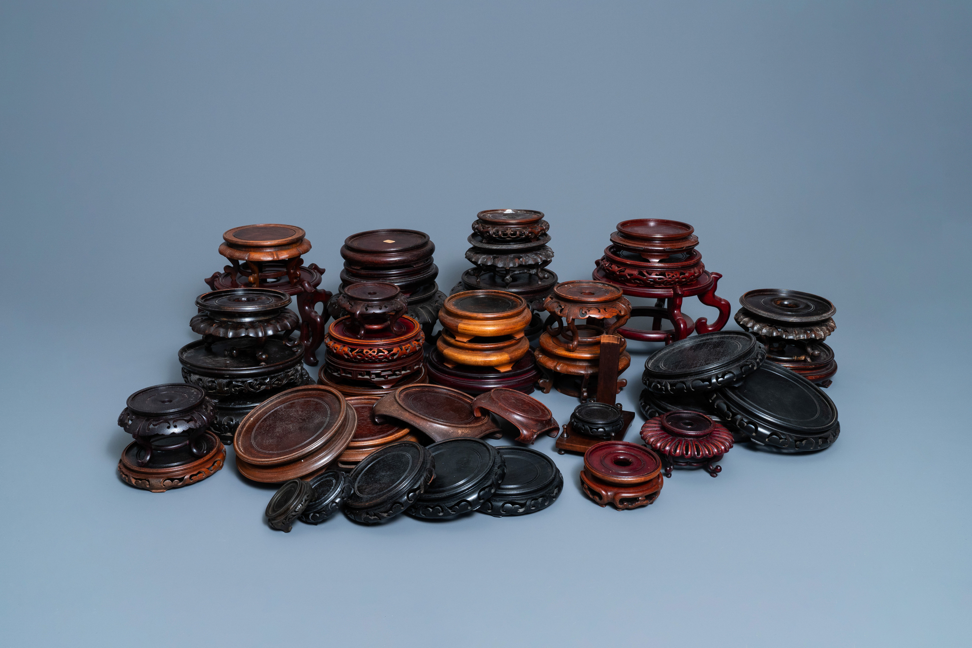 44 Chinese carved wooden stands, 19/20th C.