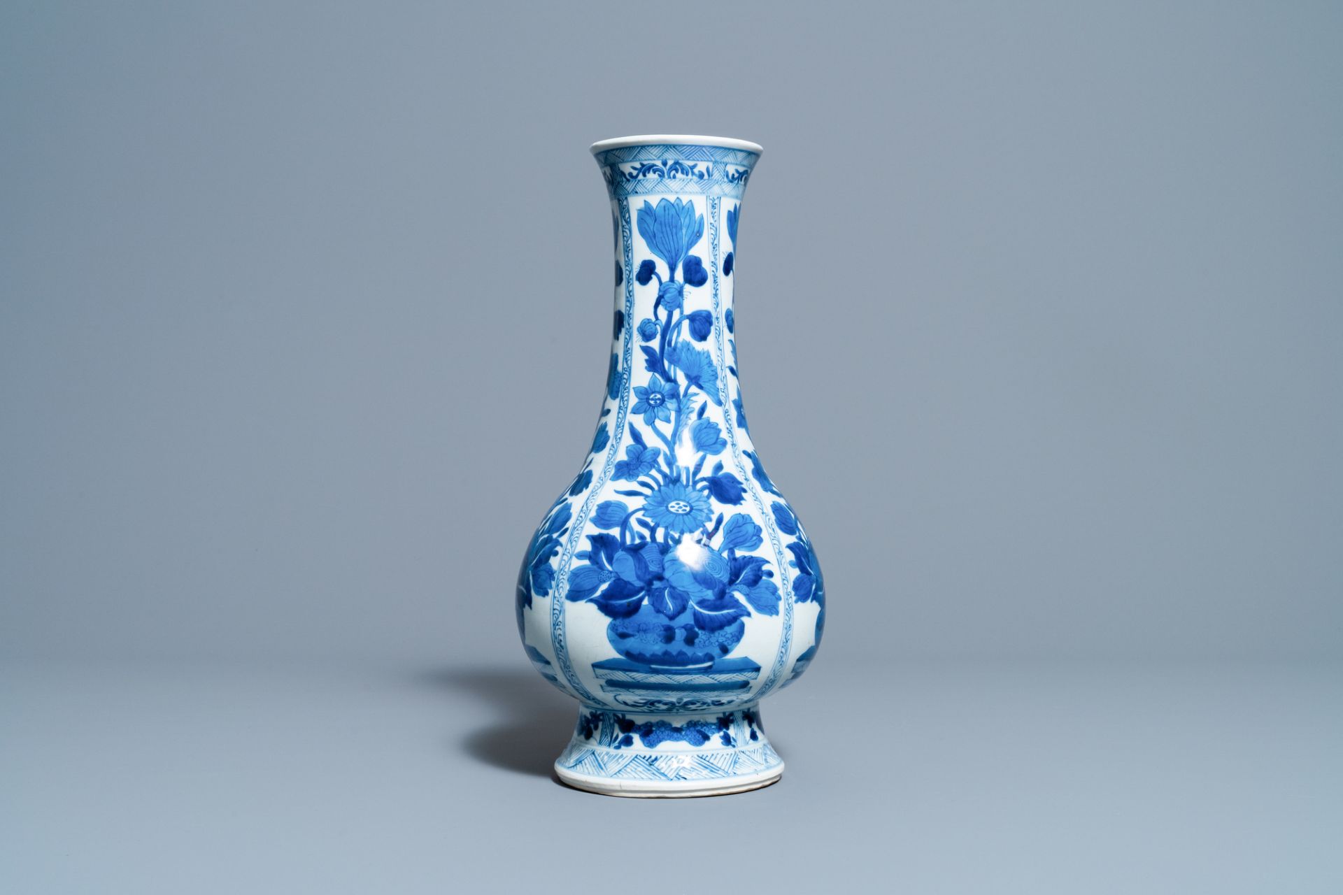 A Chinese blue and white bottle vase with flower arrangements, Kangxi - Image 2 of 6