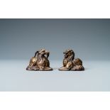 Two Chinese gilt and lacquered bronze 'mythical beast' scroll Weights, late Ming