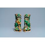 A pair of Chinese sancai-glazed biscuit Buddhist lion joss stick holders, Kangxi