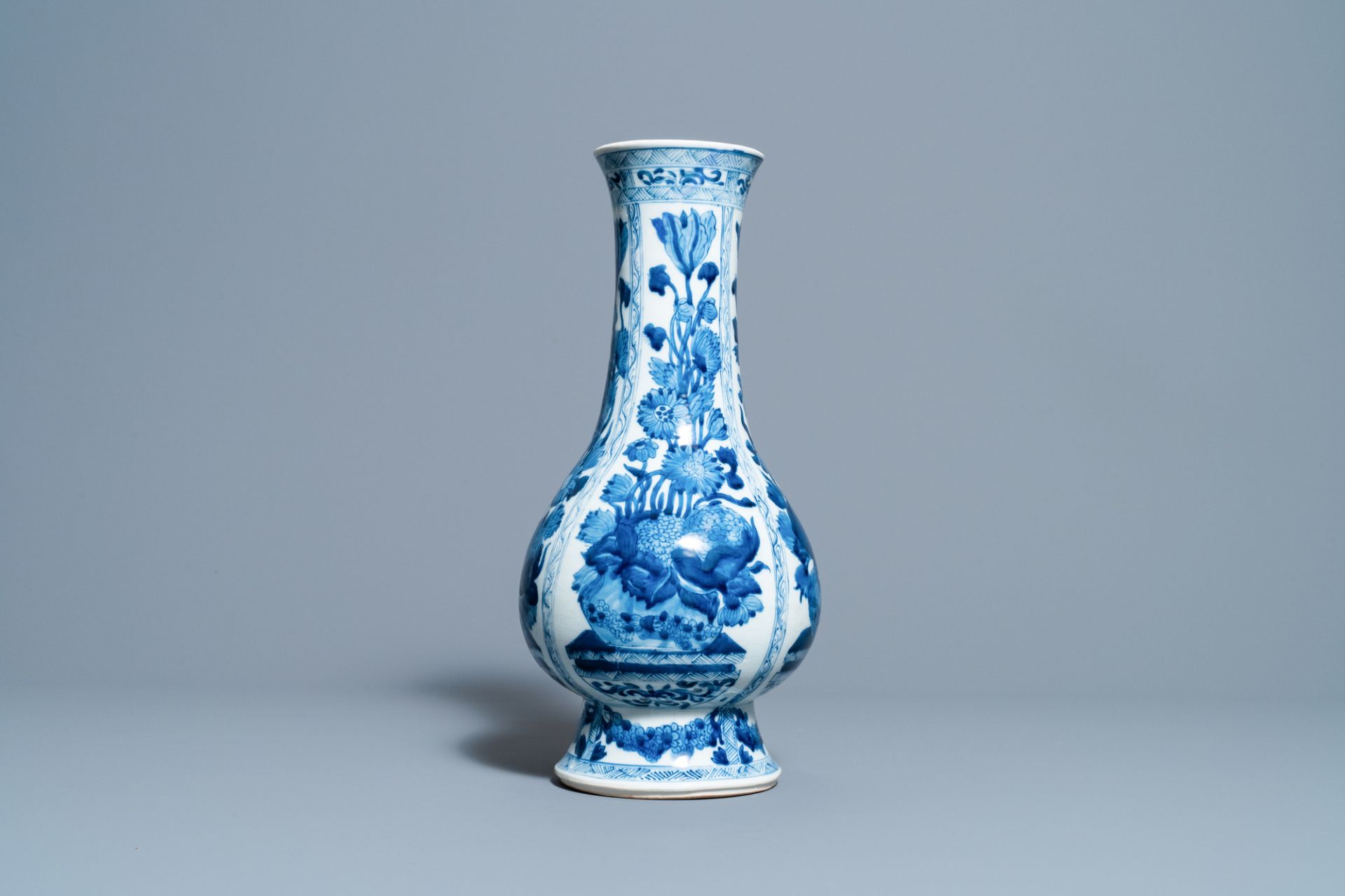 A Chinese blue and white bottle vase with flower arrangements, Kangxi - Image 2 of 6