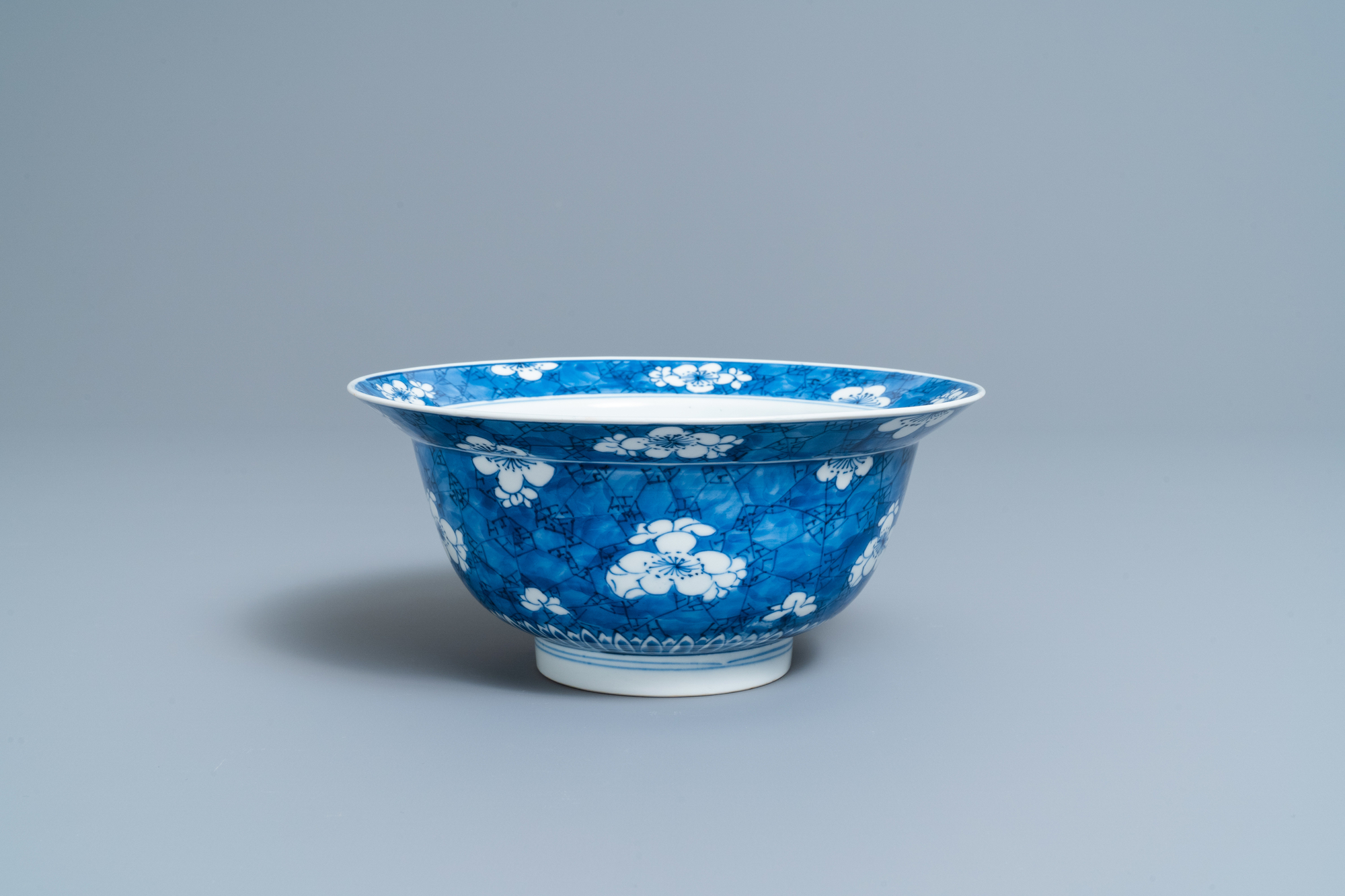 A Chinese blue and white 'prunus on cracked ice' bowl, Kangxi