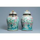 A pair of large Chinese Canton famille rose celadon-ground vases and covers, 19th C.