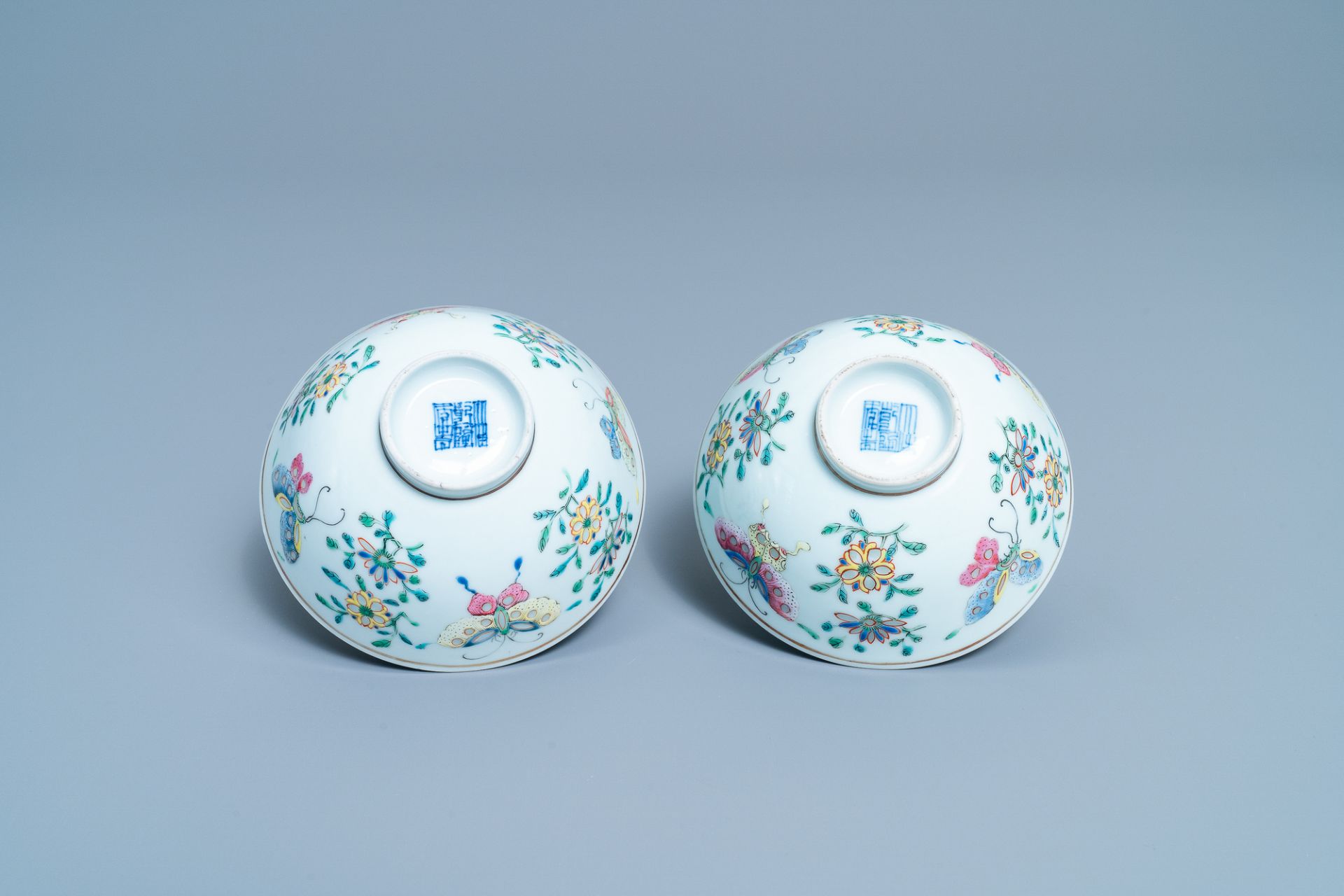 A pair of Chinese famille rose rice grain pattern 'butterfly' bowls, Qianlong mark, 19th C. - Image 6 of 10