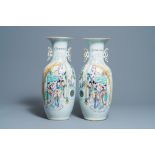 A pair of Chinese famille rose 'ladies' vases, 19/20th C.