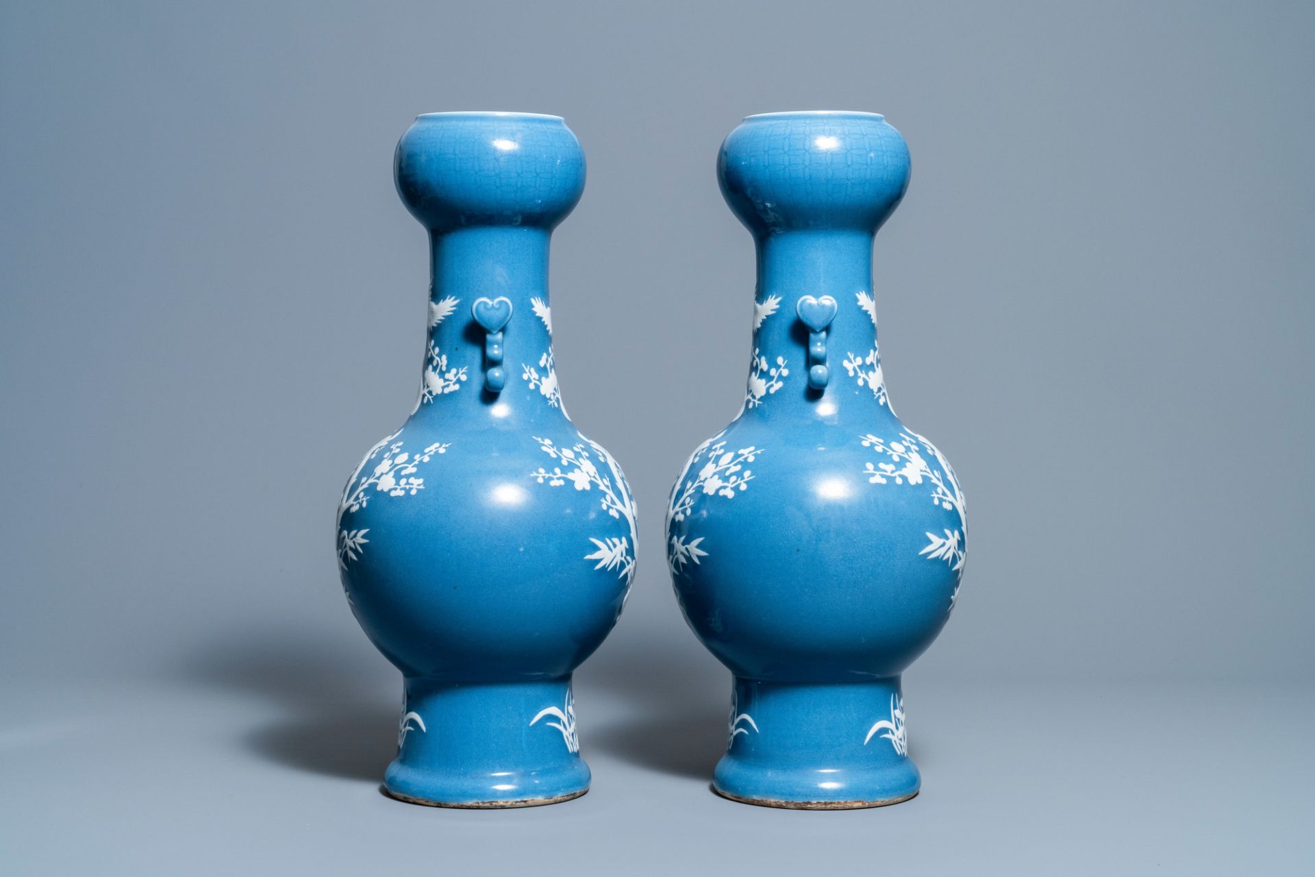 A pair of Chinese white slip-decorated blue-ground vases, 19th C. - Image 4 of 6