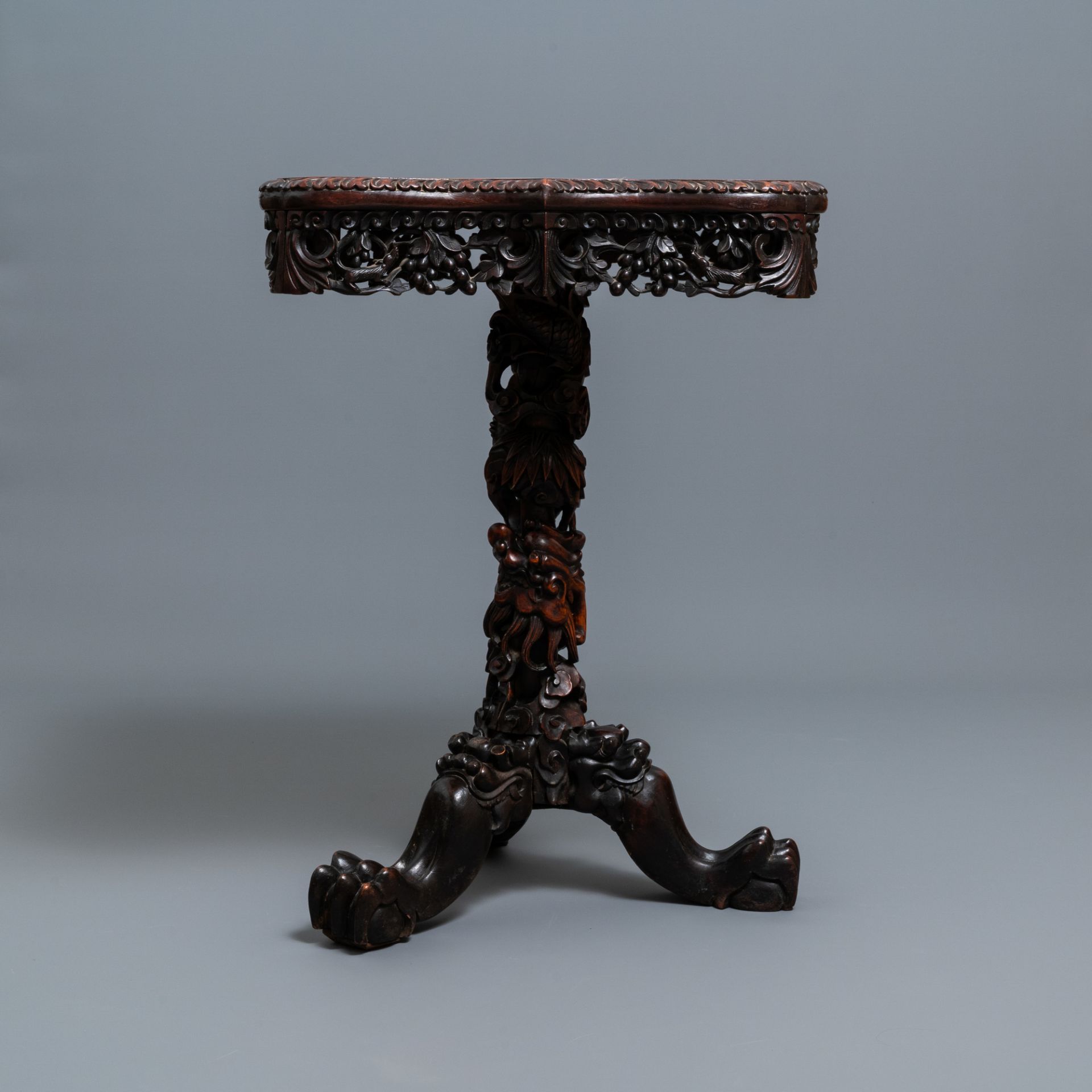 A Chinese carved wooden side table with marble chessboard top, 19th C. - Image 2 of 17