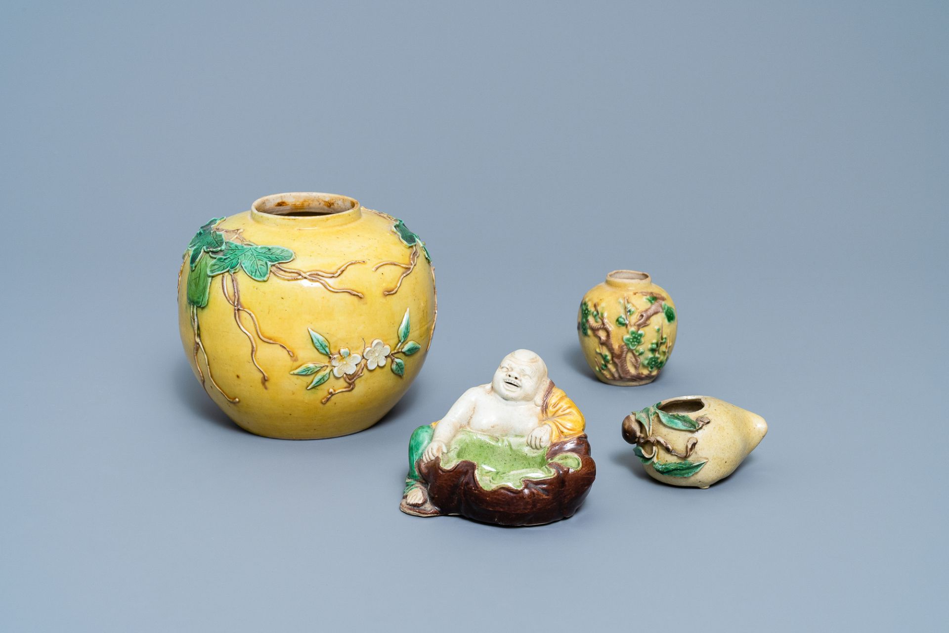 Two Chinese biscuit jars, a Buddha figure and a brushwasher, 19/20th C.