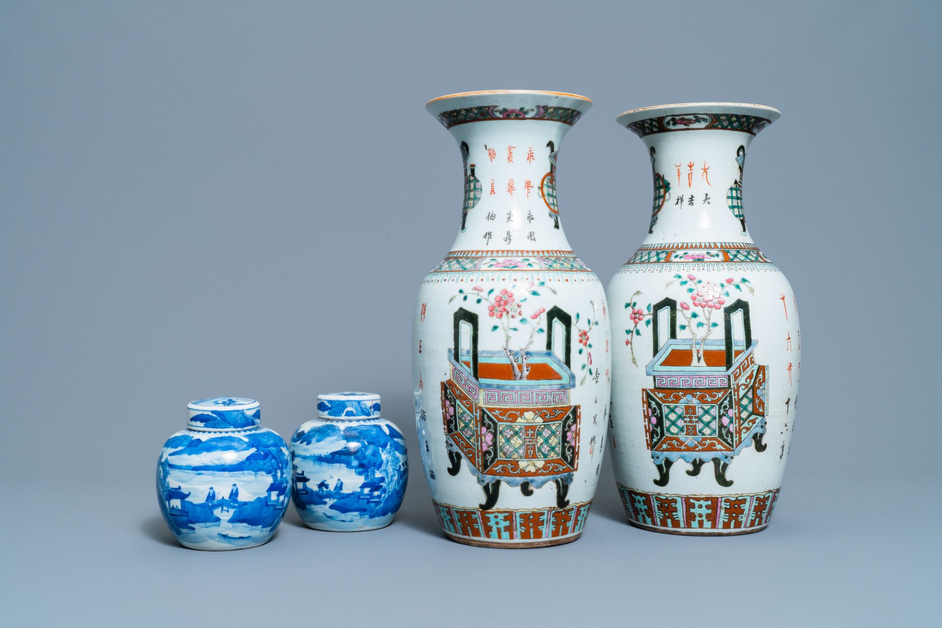 A pair of Chinese blue and white covered jars and a pair of famille rose vases, 19th C.