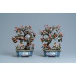 A pair of large Chinese Canton enamel jardinieres with jade and hardstone trees, 19th C.