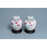 A pair of Chinese famille rose jars and covers with floral design, Qianlong