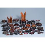 A varied collection of ca. 50 Chinese carved wooden stands, 19/20th C.