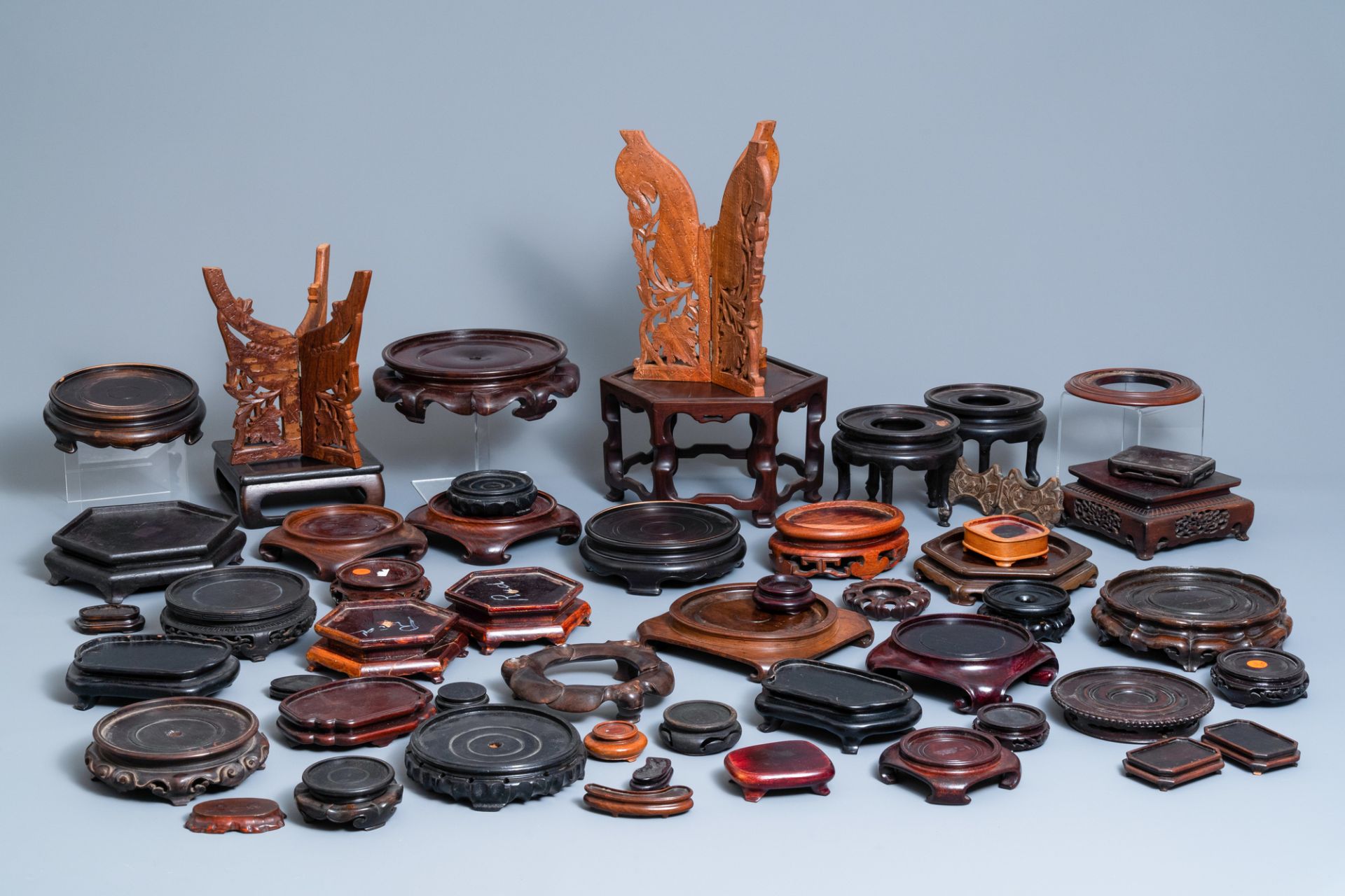 A varied collection of ca. 50 Chinese carved wooden stands, 19/20th C.