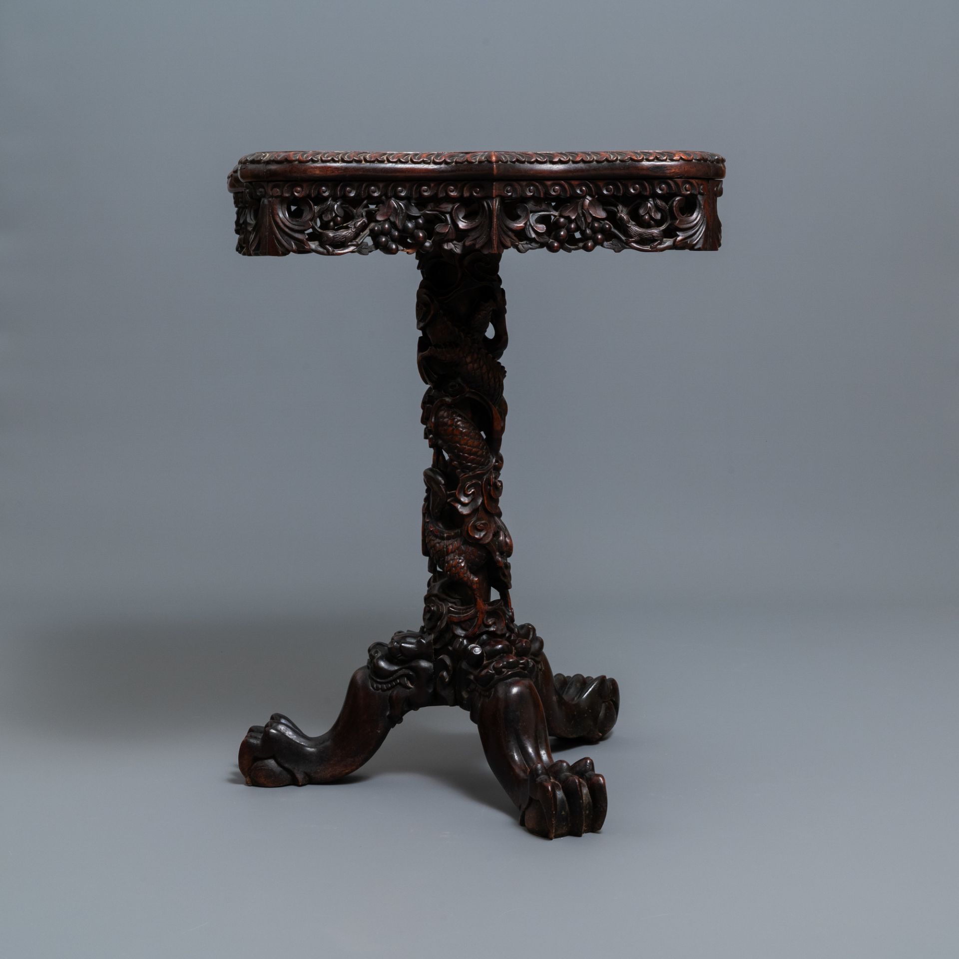 A Chinese carved wooden side table with marble chessboard top, 19th C. - Image 4 of 17