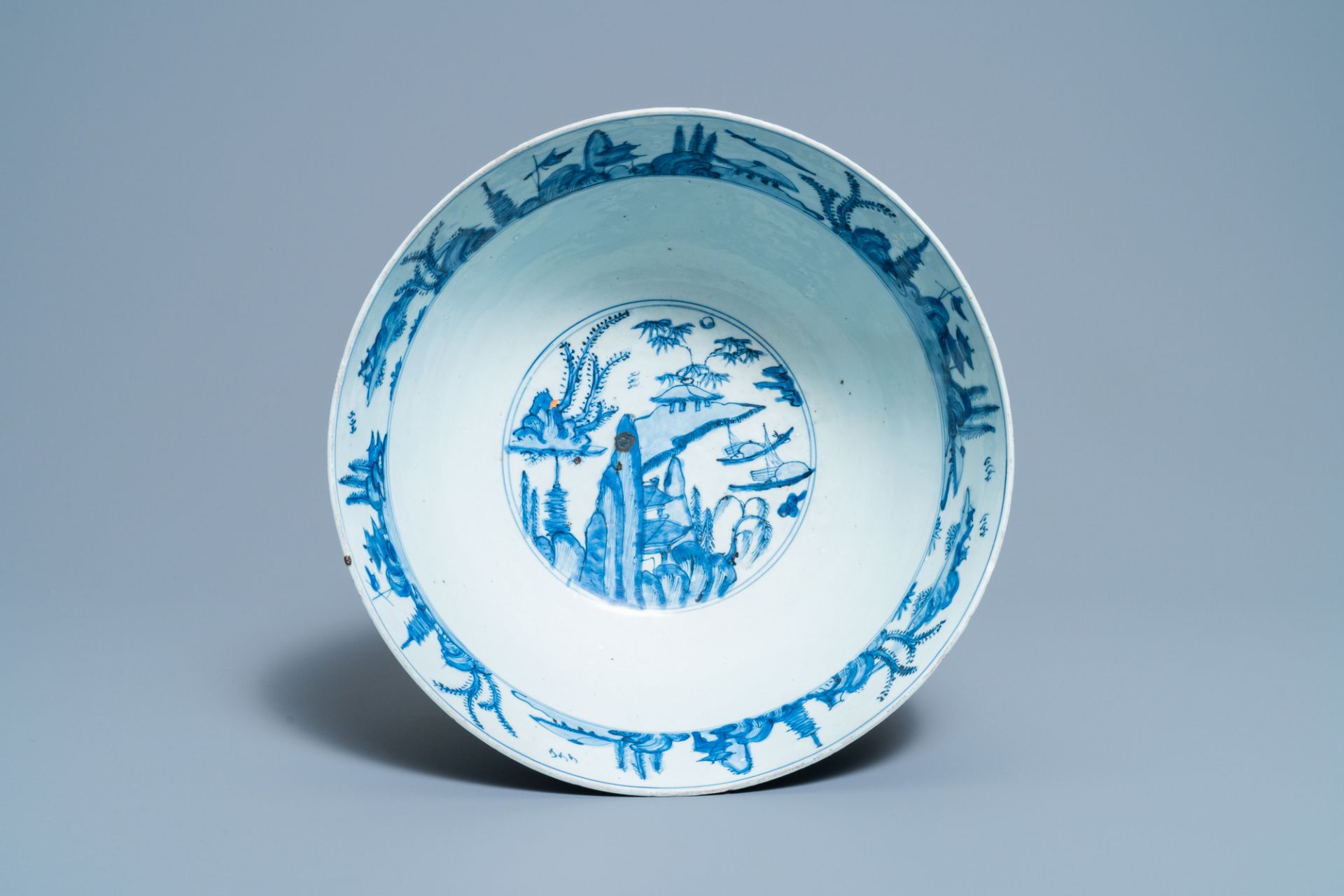 A large Chinese blue and white 'river landscape' bowl, Ming - Image 6 of 13