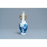 A Chinese blue and white vase with gilt elephant-head handles, Kangxi