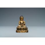 A Sino-Tibetan gilt bronze figure of Buddha, Ming