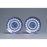 A pair of Dutch Delft blue and white dishes, dated 1713