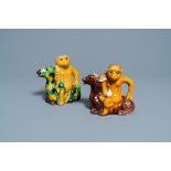 Two Chinese sancai-glazed 'monkey on deer' ewers, 19th C.