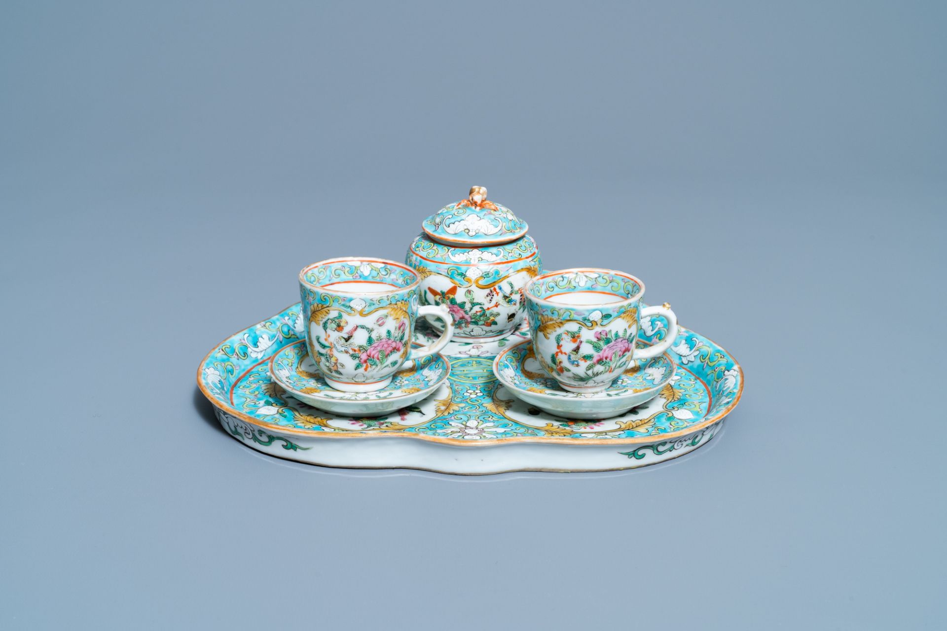 A Chinese famille rose 'tete-a-tete' tea service on tray, 19th C.