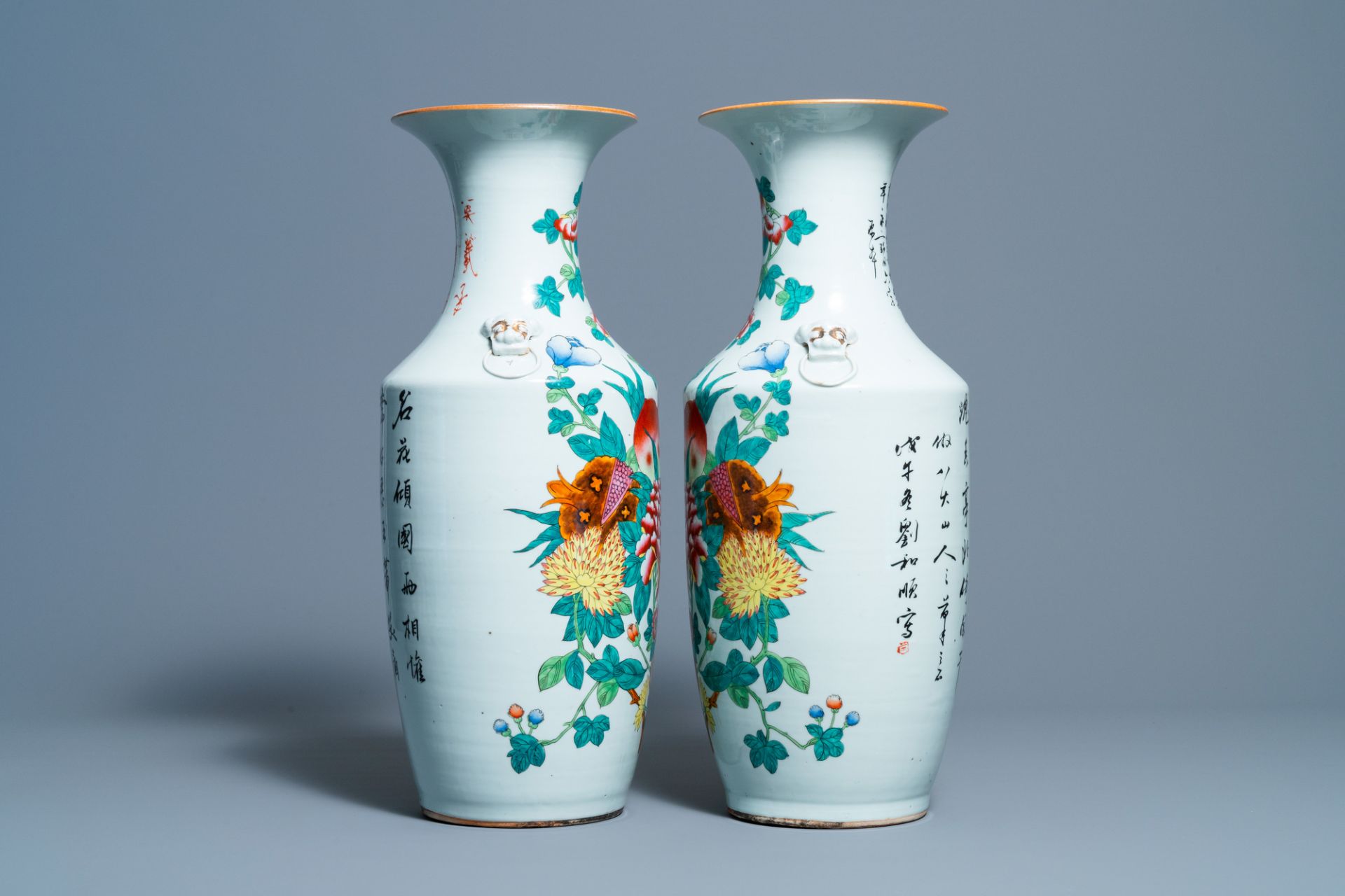 A pair of Chinese famille rose vases with fruits and flowers, 19/20th C. - Image 4 of 6