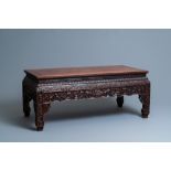 A Chinese huanghuali wood 'kangzhuo' low table, 18th C.