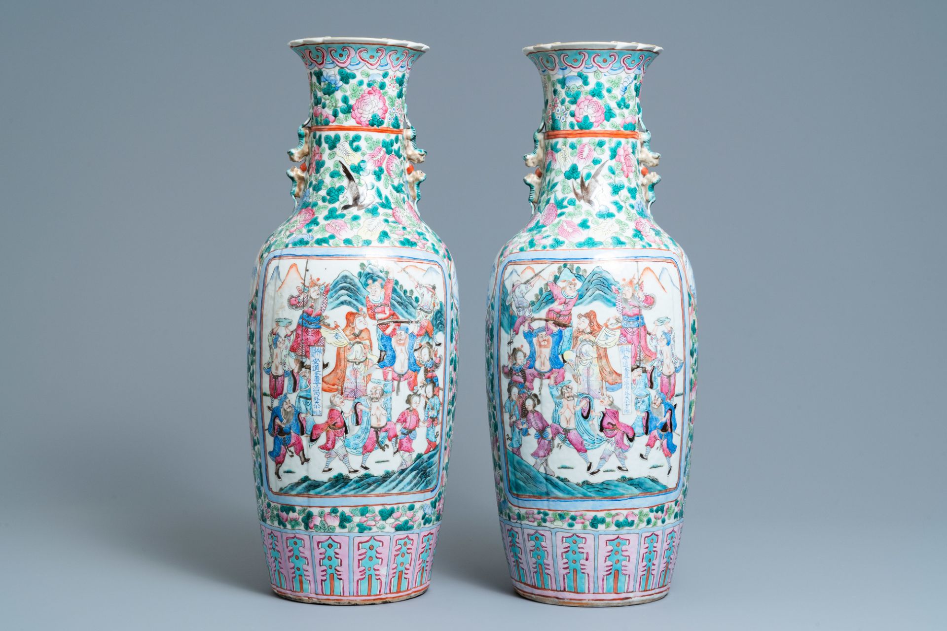 A pair of Chinese famille rose vases with court and warrior scenes, 19th C.