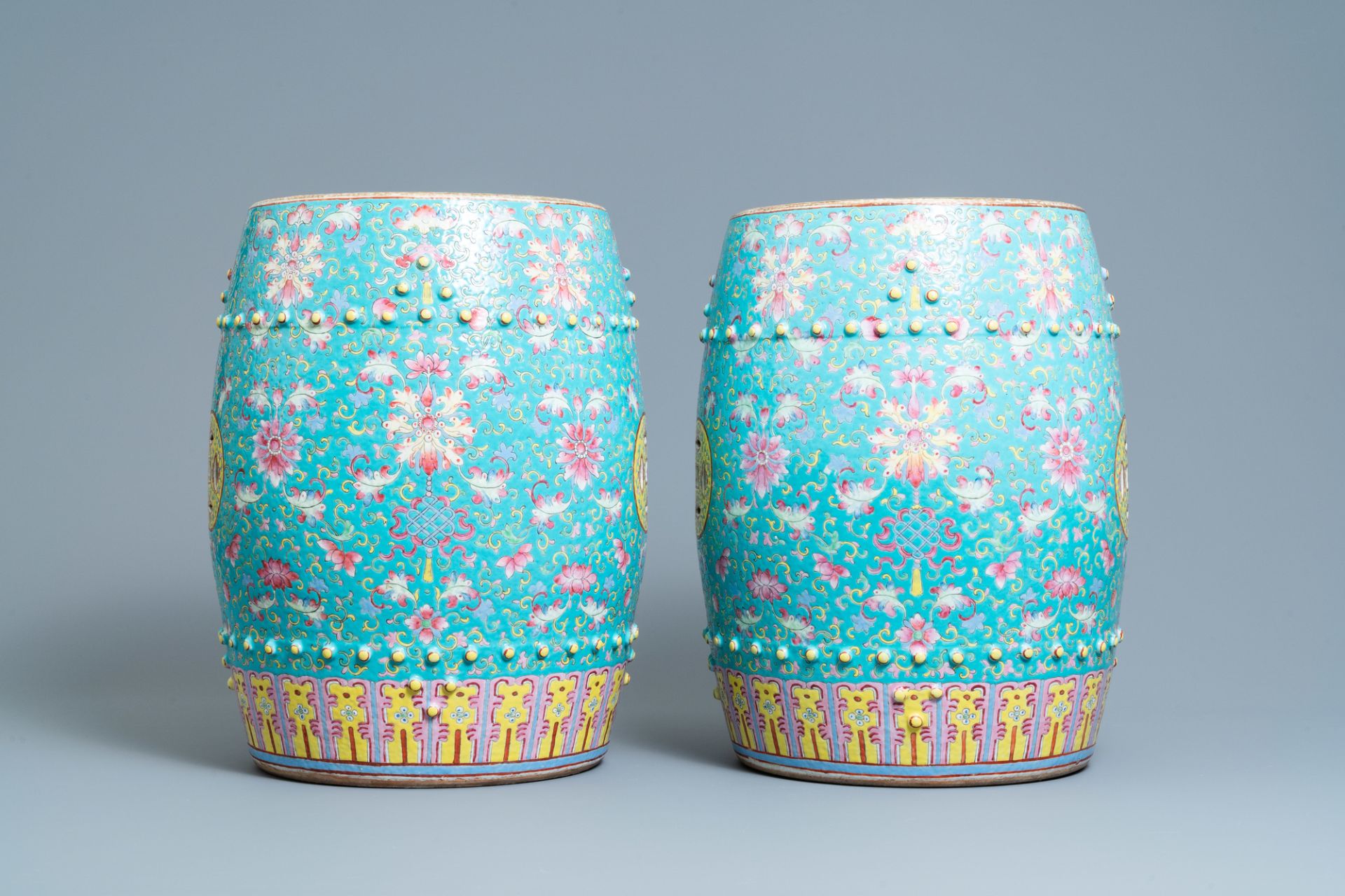 A pair of Chinese turquoise-ground famille rose garden seats, 19th C. - Image 3 of 7