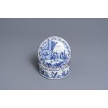 A round Dutch Delft blue and white box and cover with tobacco harvesting scenes, 18th C.