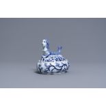 A Dutch Delft blue and white butter tub in the shape of a mermaid, 18th C.