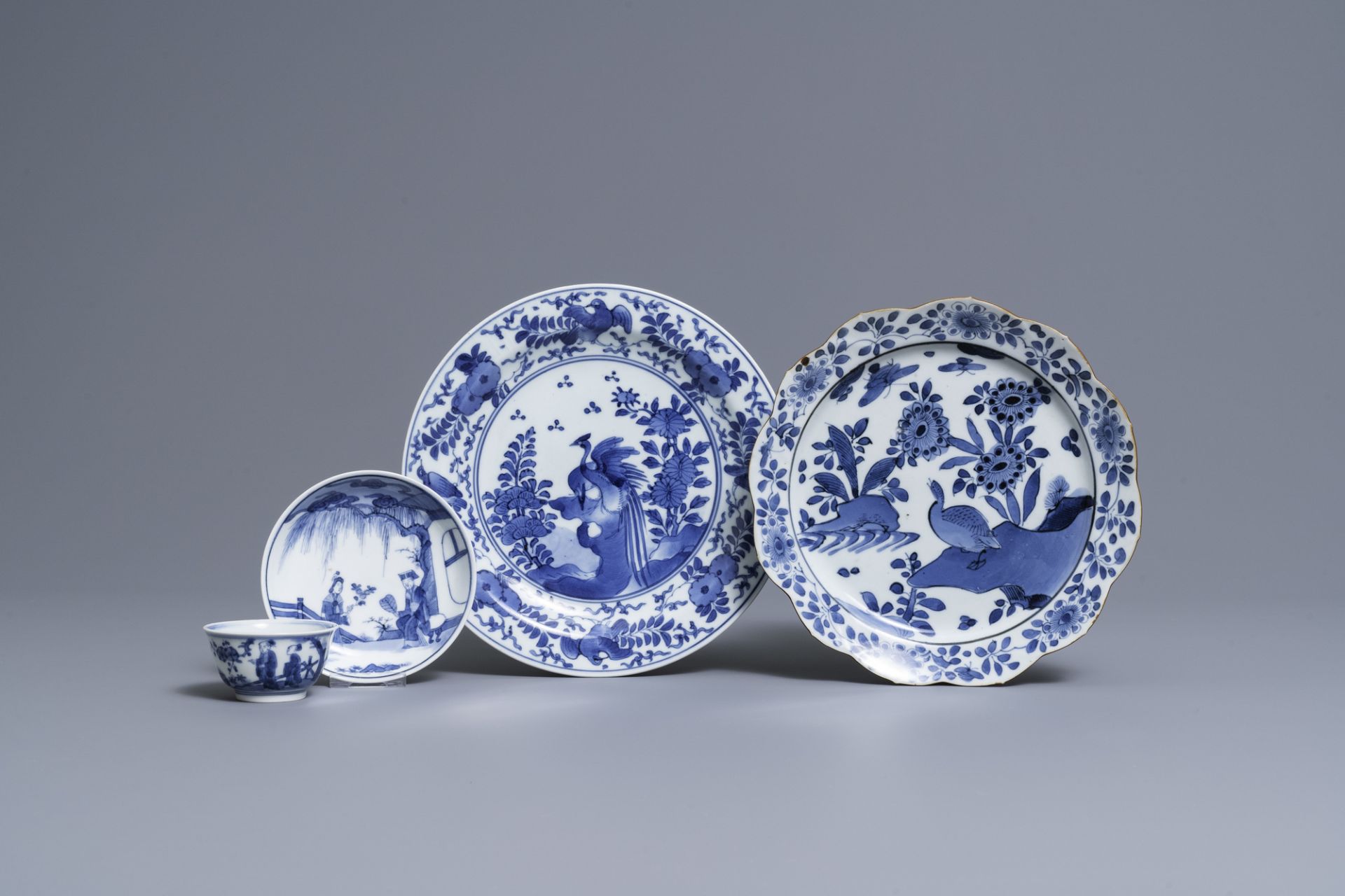 Two Japanese blue and white Arita plates and a cup and saucer, Edo, 17/18th C.