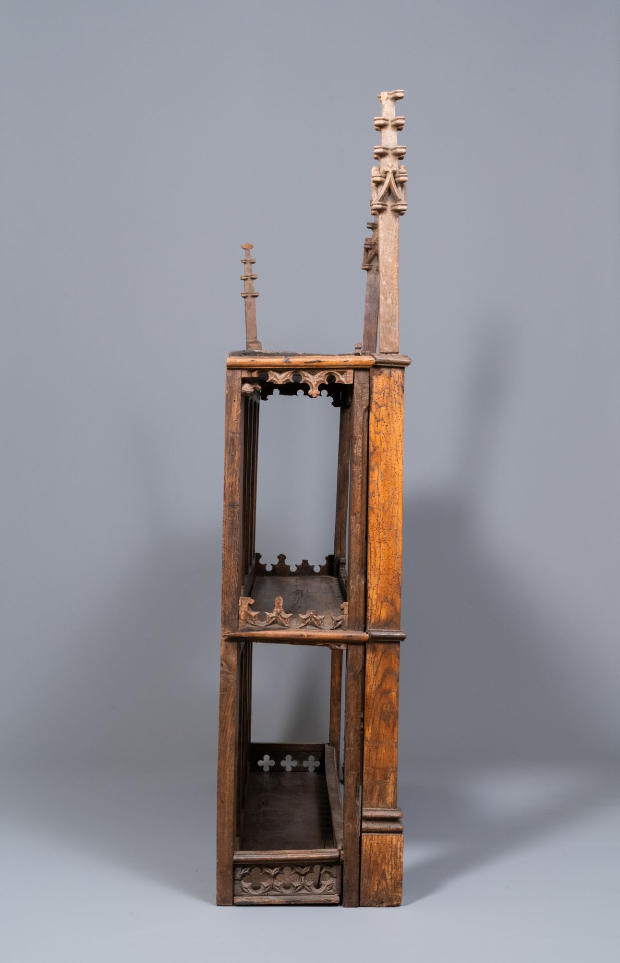 A carved oak shelf with pinnacles and stylised flowers and carved panels, 15th C. and later - Image 6 of 12