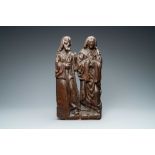 An oak retable fragment depicting two figures, Flanders, 1st half 16th C.