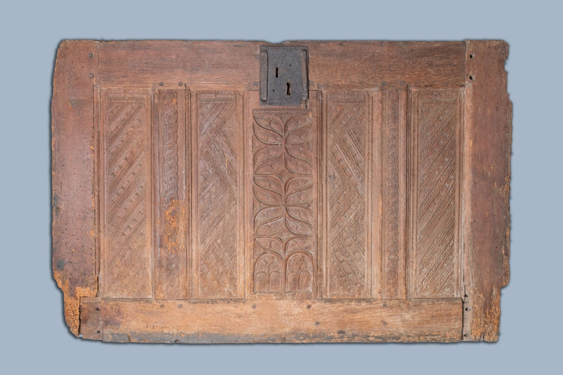 A carved oak front panel of a coffer with tracery panels and geometrical motives, Brittany, France,