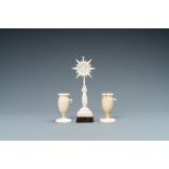 A small ivory crucifix monstrance and a pair of small bone candlesticks, Dieppe, France, 19th C.