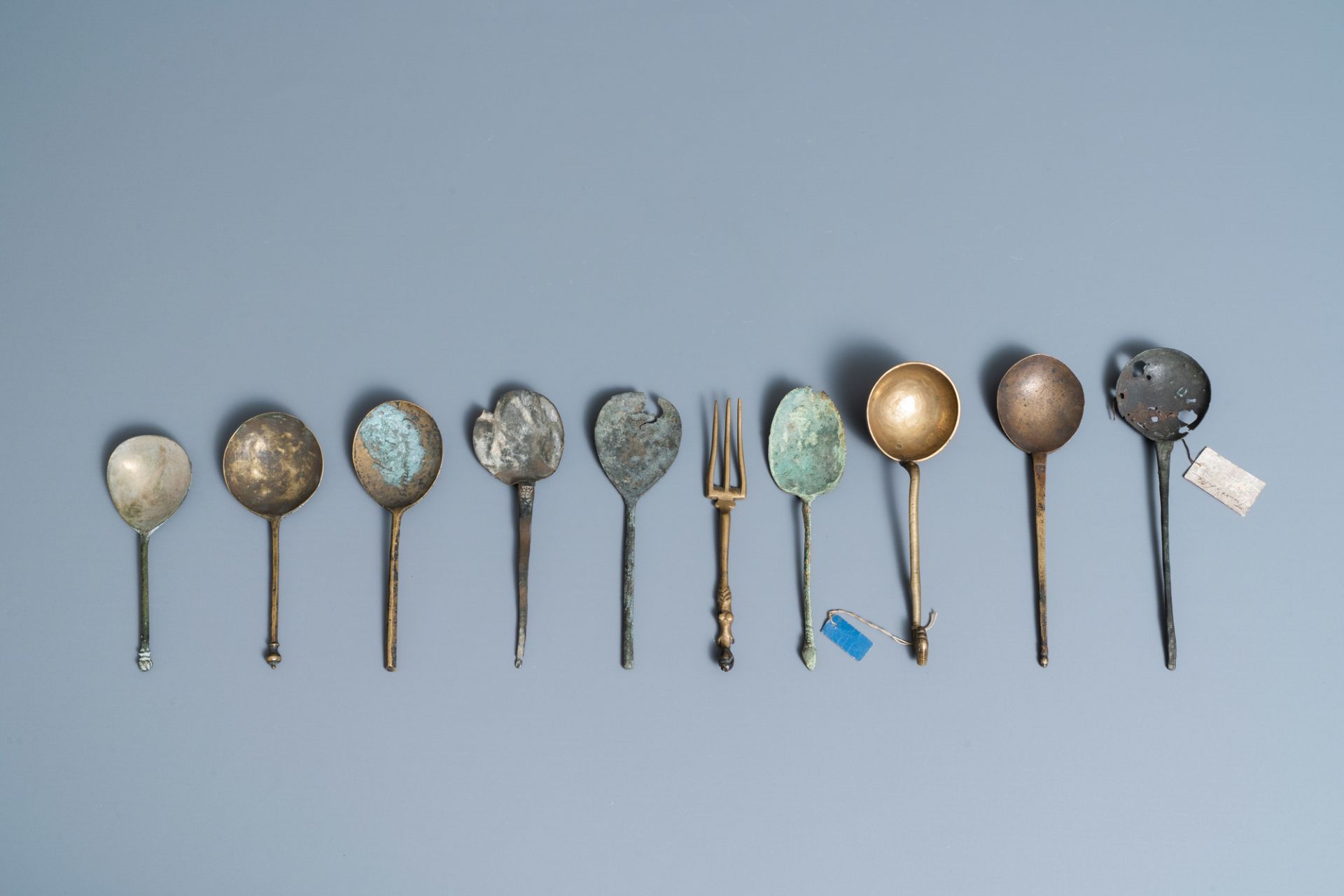 Nine brass spoons and a small fork, 15/16th C. - Image 3 of 4