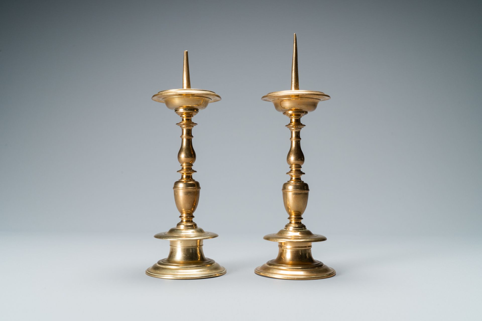 A pair of brass alloy candlesticks, Italy, 17th C. - Image 2 of 7
