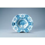 A gadrooned Dutch Delft blue and white shaving bowl, 18th C.