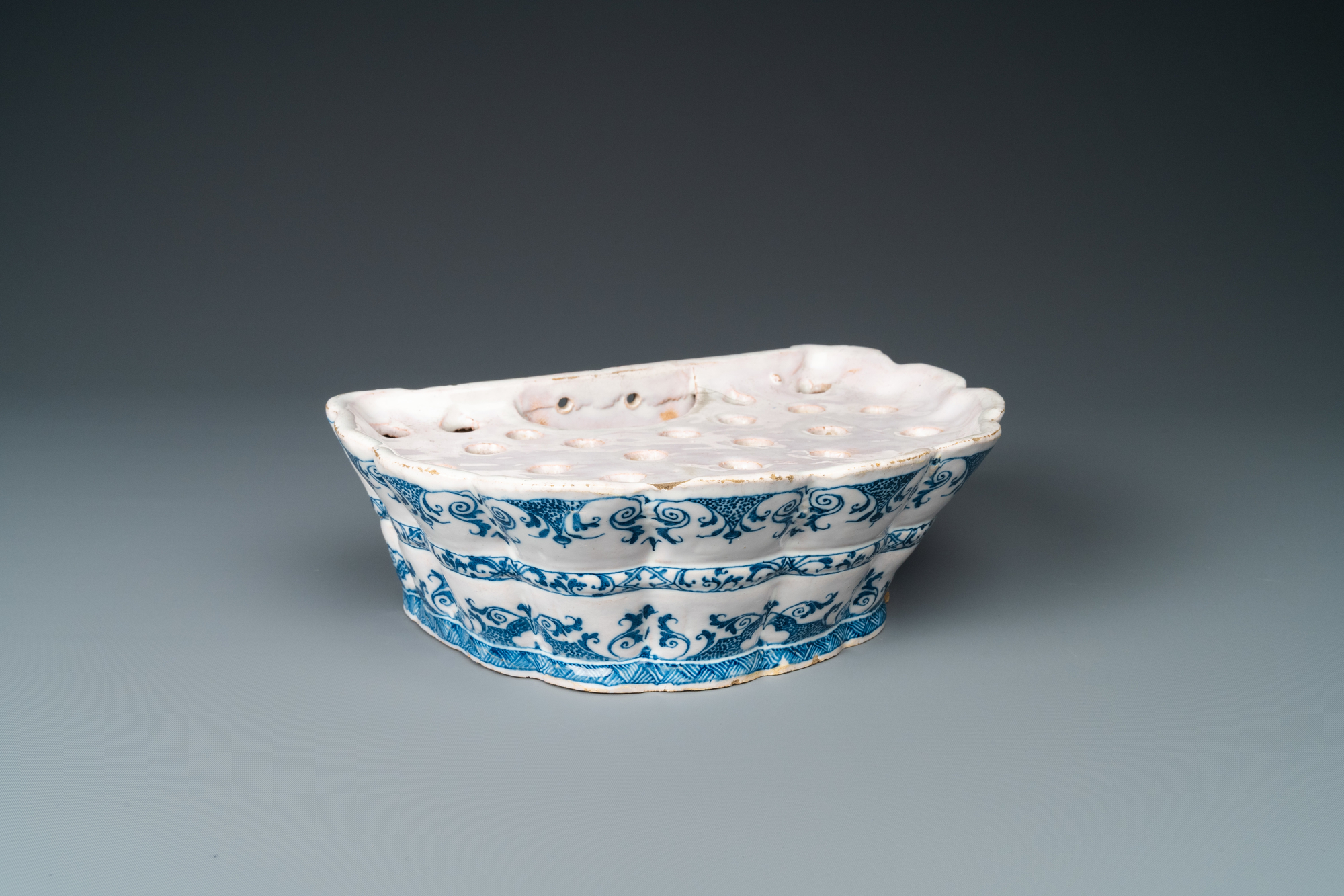 A blue and white Moustiers faience flower holder, France, 18th C.