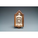 An ivory Madonna retable in wooden frame, 17/18th C.