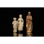 Three ivory figures of a Madonna, a fish seller and a young lad, a.o. Dieppe, France, 18/19th C.